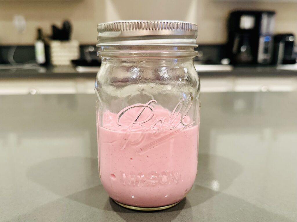 Homemade slime stored in a mason jar.