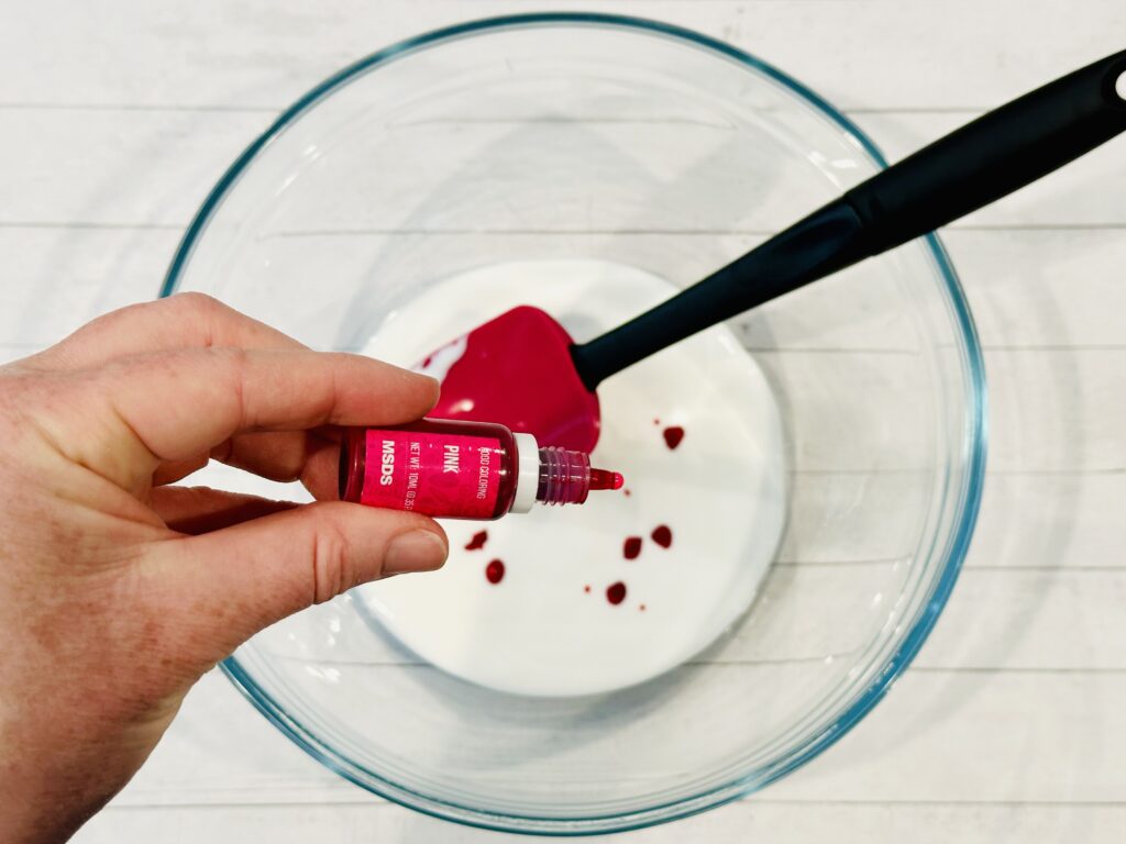 Adding food coloring into the glue mixture