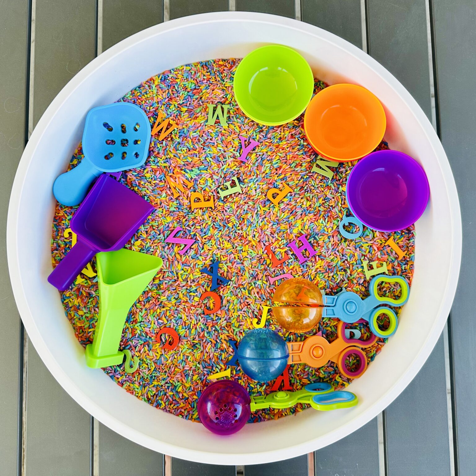 How To Make A Rainbow Rice Alphabet Hunt Sensory Bin - Raising Wild ...