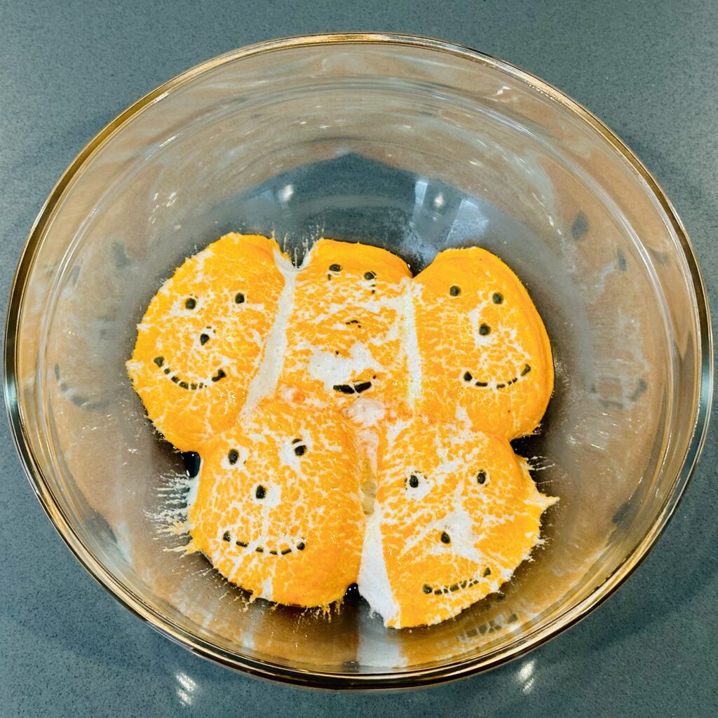 Pumpkin peeps in a mixing bowl after being microwaved