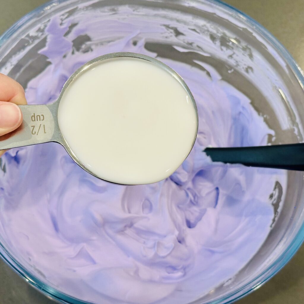 Glue added to the shaving cream in a mixing bowl.