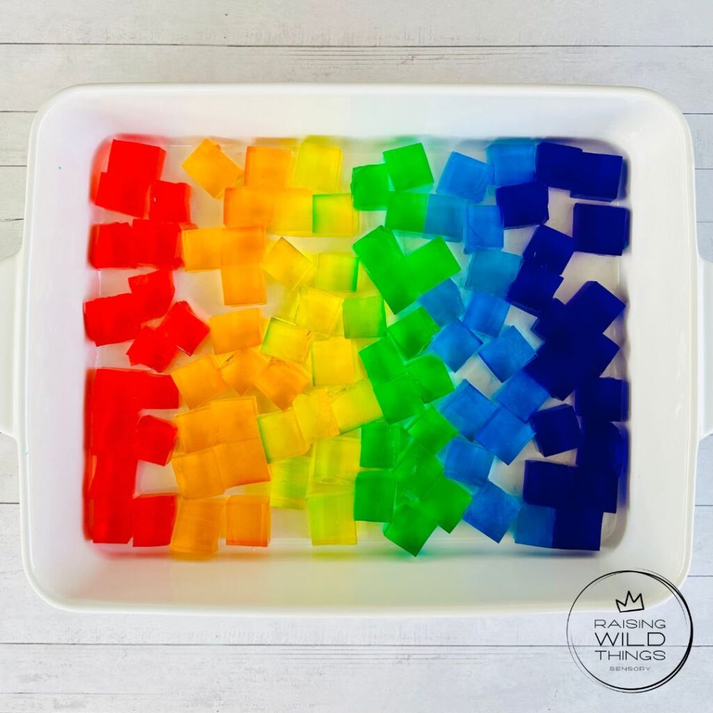 Rainbow Jello Blocks cut into cubes and placed in a baking dish.