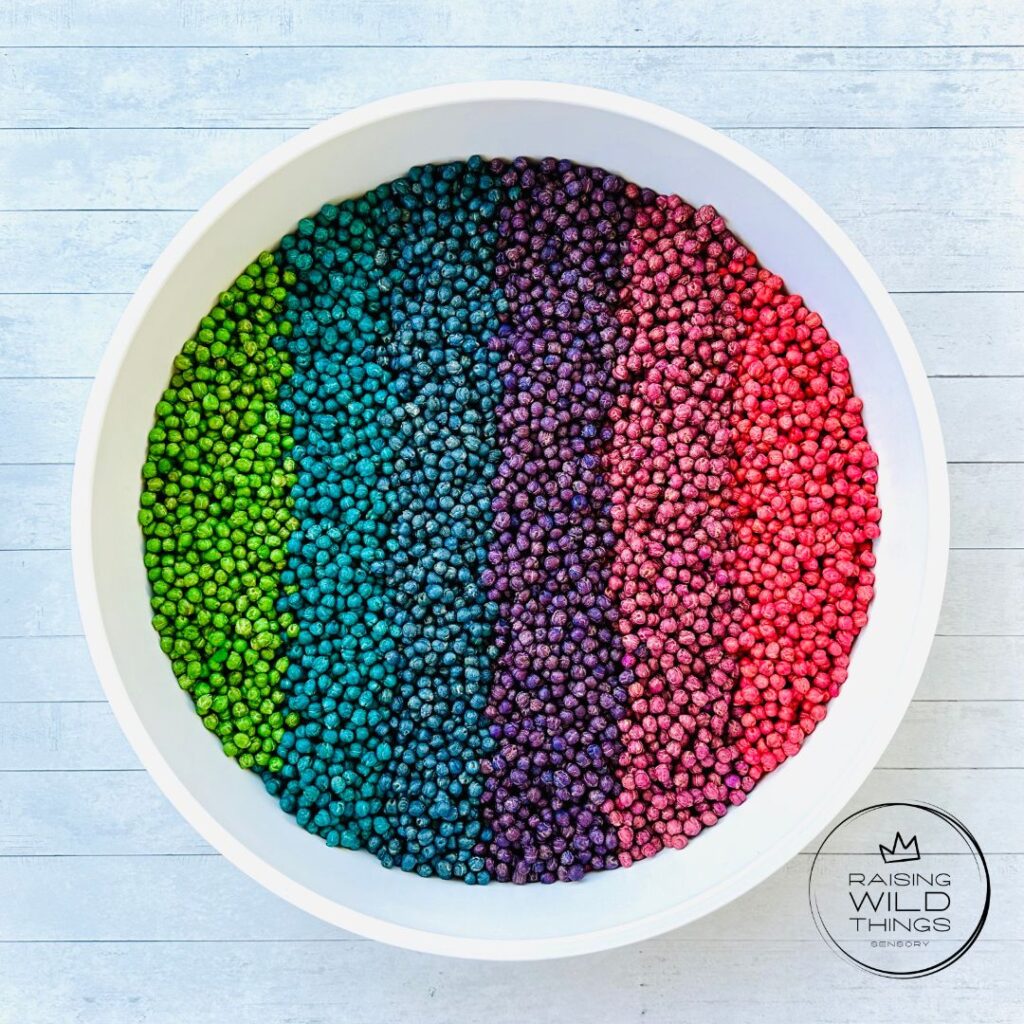 Rainbow chickpeas in a sensory bin