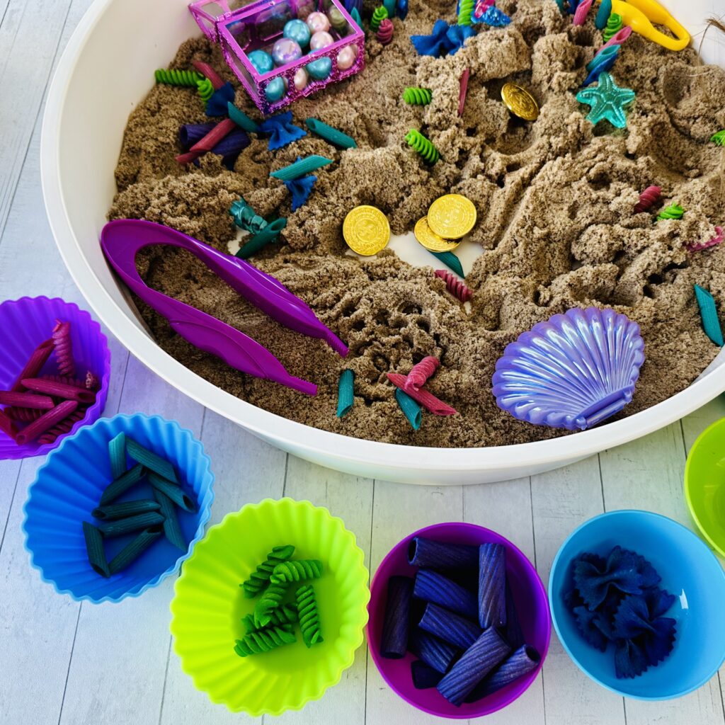 Kids digging through the mermaid sensory bin