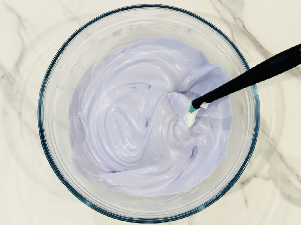 Food coloring added to the shaving cream, glue, and baking soda mixture.