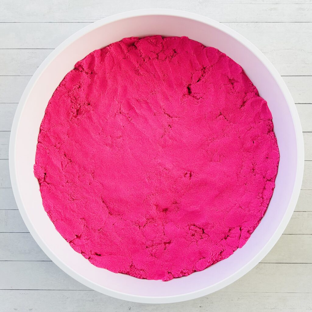 Pink Kinetic Sand sensory bin base