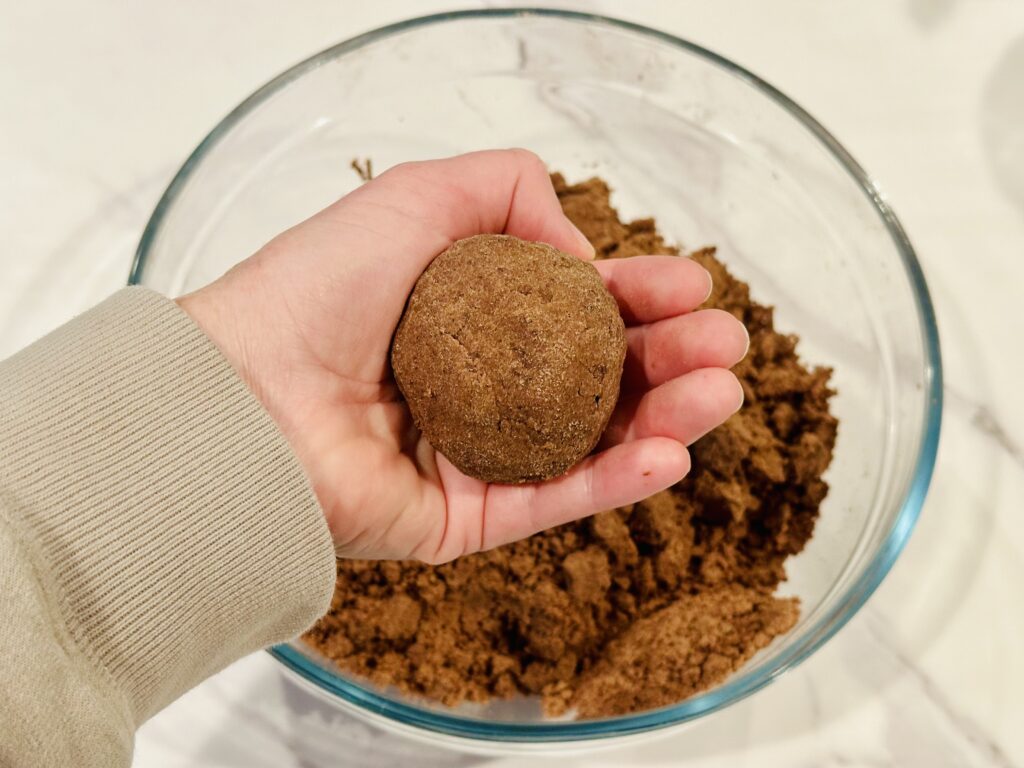 Testing the texture of the Hot Chocolate Cloud Dough