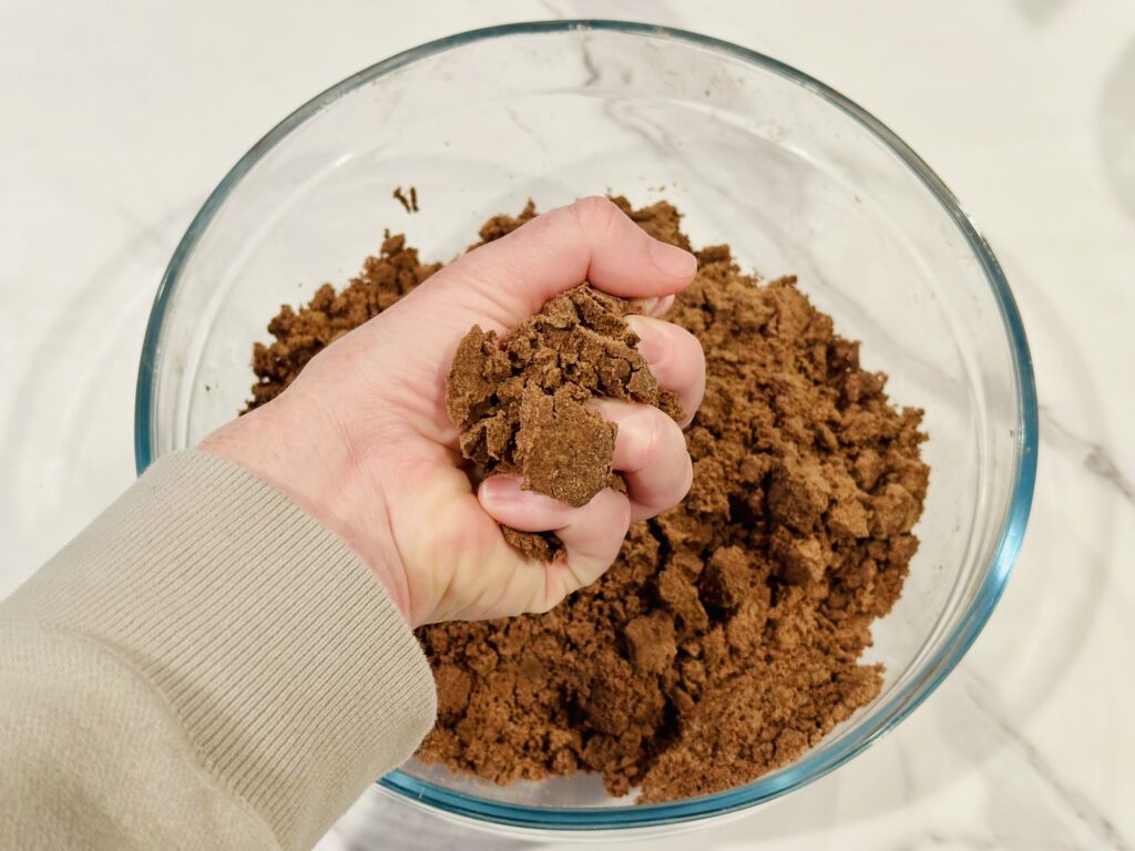 Testing the texture of the Hot Chocolate Cloud Dough