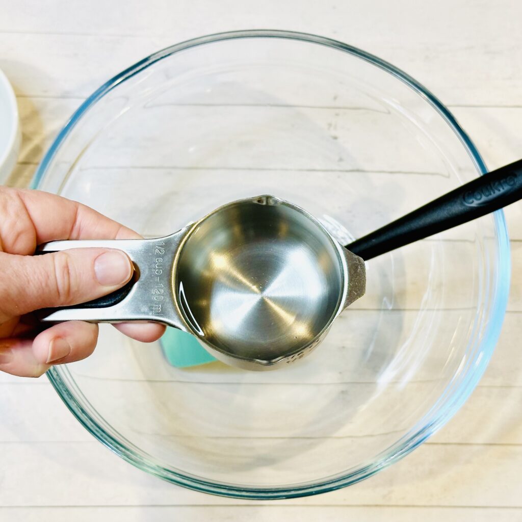 Adding clear glue to a mixing bowl