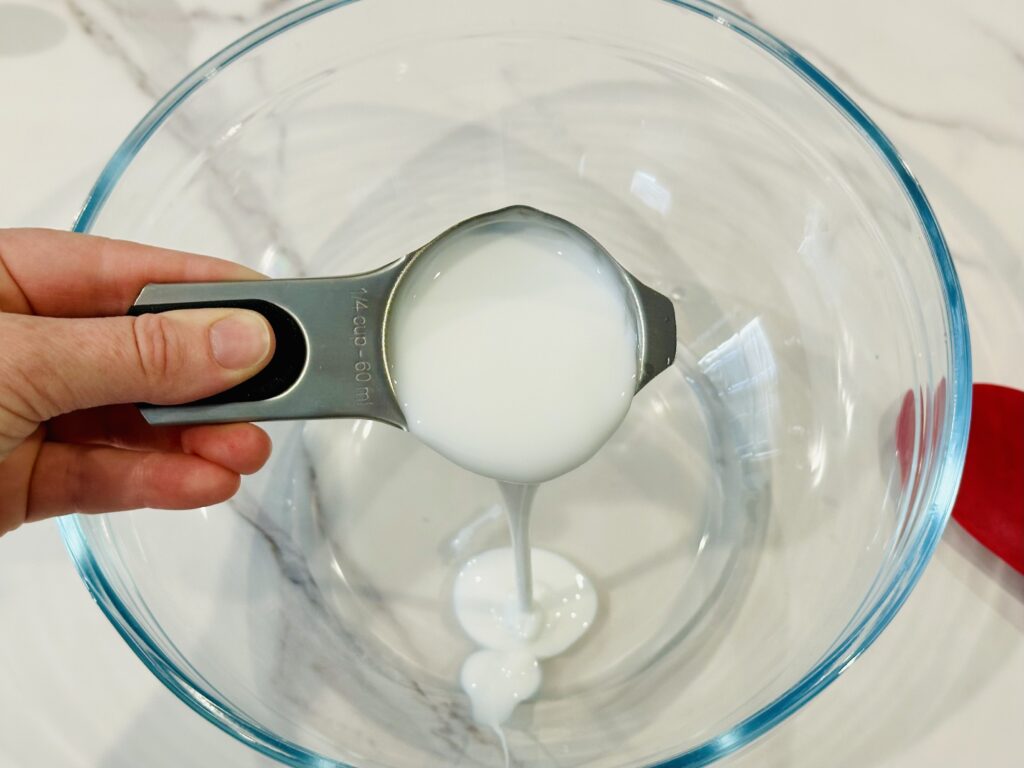 Combine 1/4 cup white glue with 1/4 cup warm water