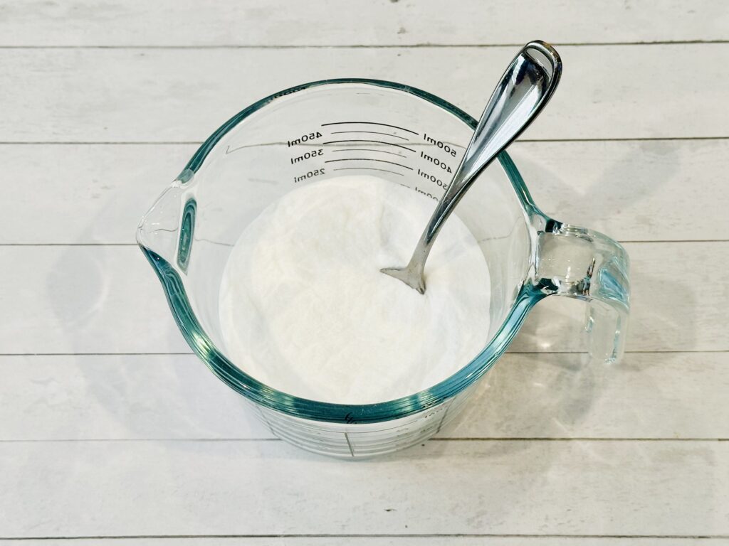 Gelatin powder and baking soda combined in a mixing bowl to make Valentine's Day Fizzy Heart Ice Cubes