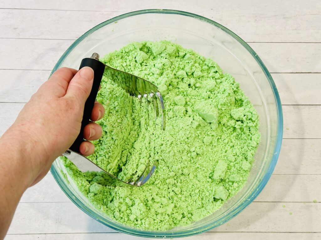 Kneading the St. Patrick's Day Moon Dough with a pastry cutter