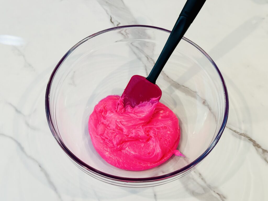 Frosting added to a mixing bowl