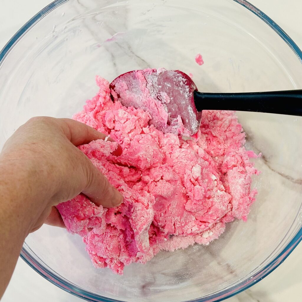 Kneading the edible play dough by hand