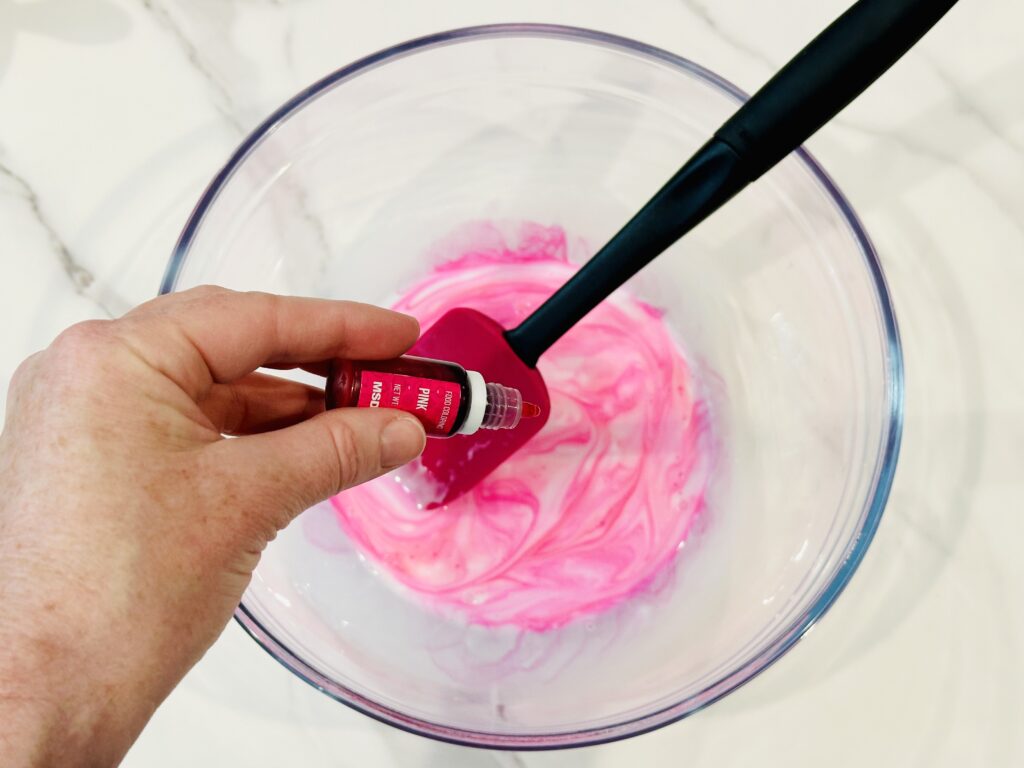 Add a few drops of food coloring to the glue mixture