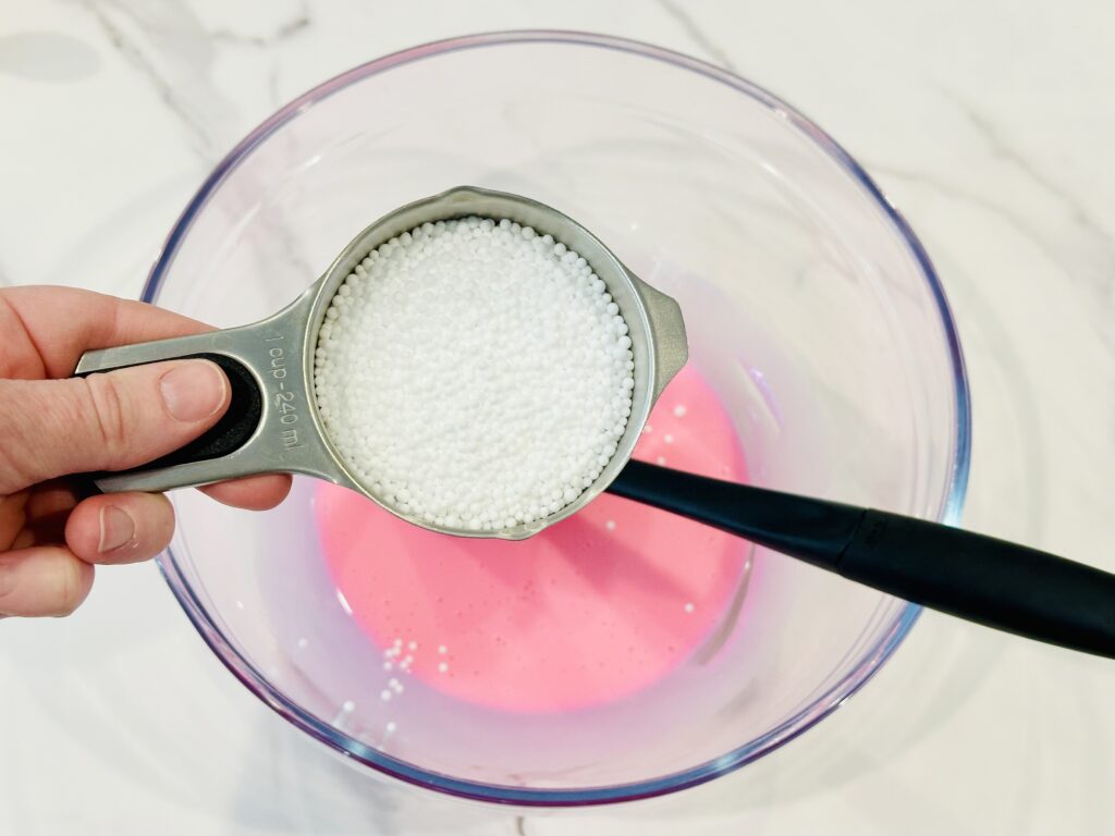 Add the polystyrene beads to the glue mixture.