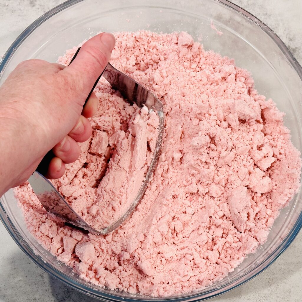 Kneading the moon dough with a pastry cutter.