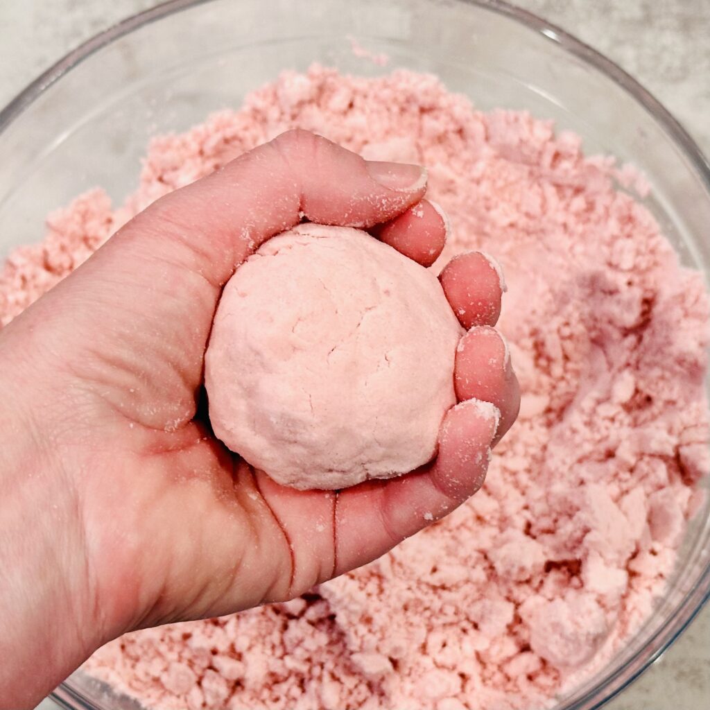 Testing the texture of the Valentine's Day Moon Dough.