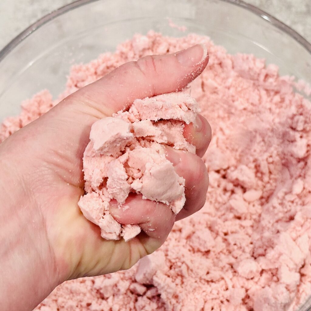 Testing the texture of the Valentine's Day Moon Dough.