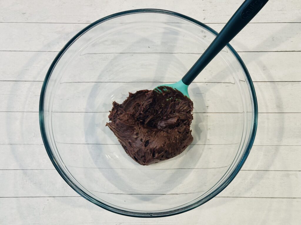 Frosting added to a mixing bowl