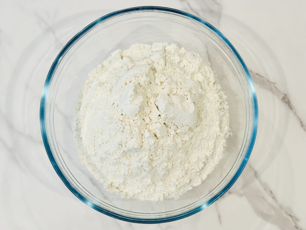 Flour added to a mixing bowl