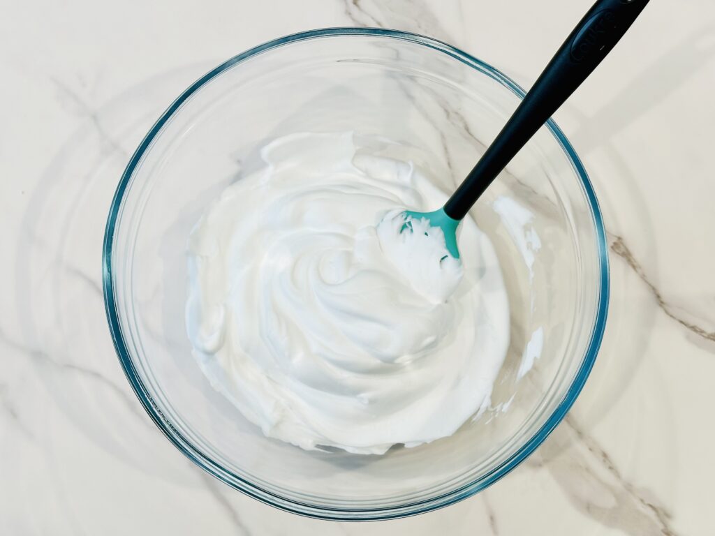 Adding shaving foam to a mixing bowl