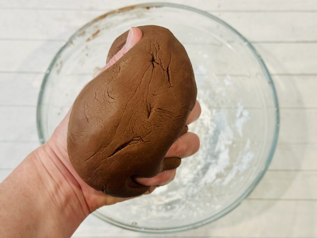 Kneading the edible play dough by hand