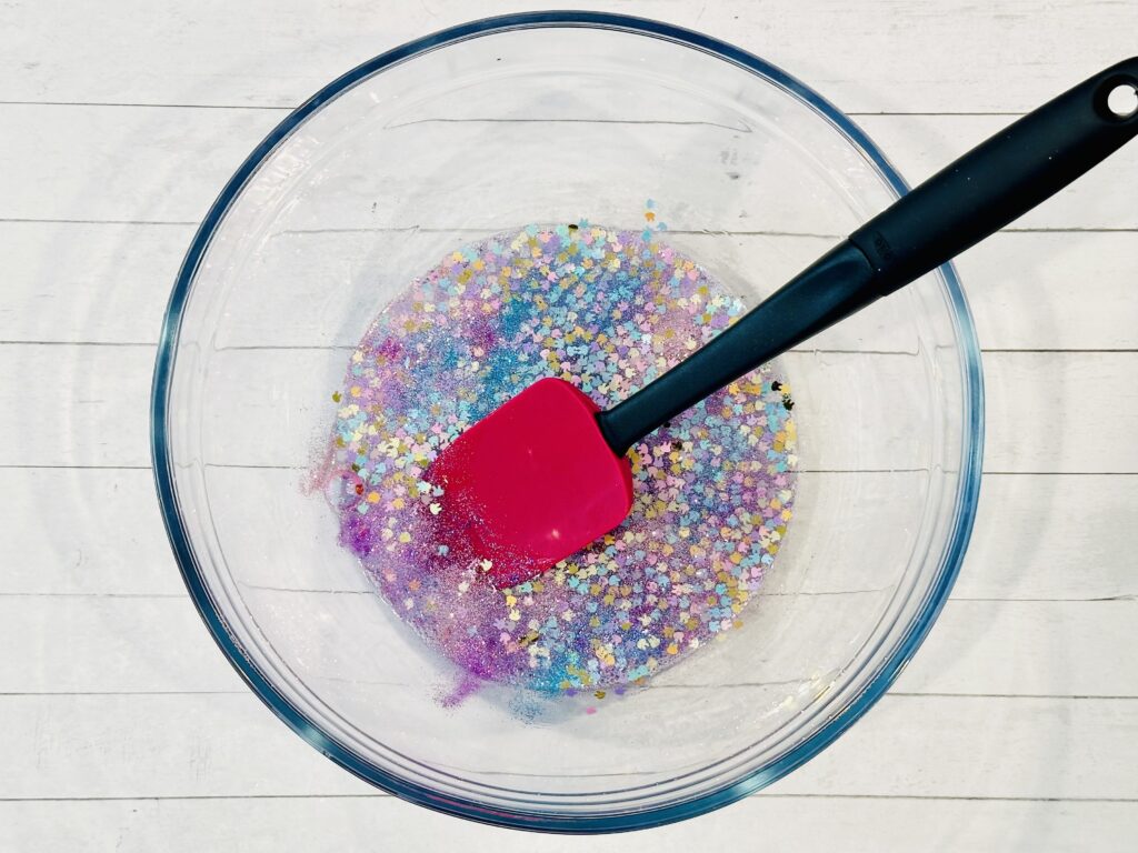 Mixing in glitter and bunny-shaped confetti.