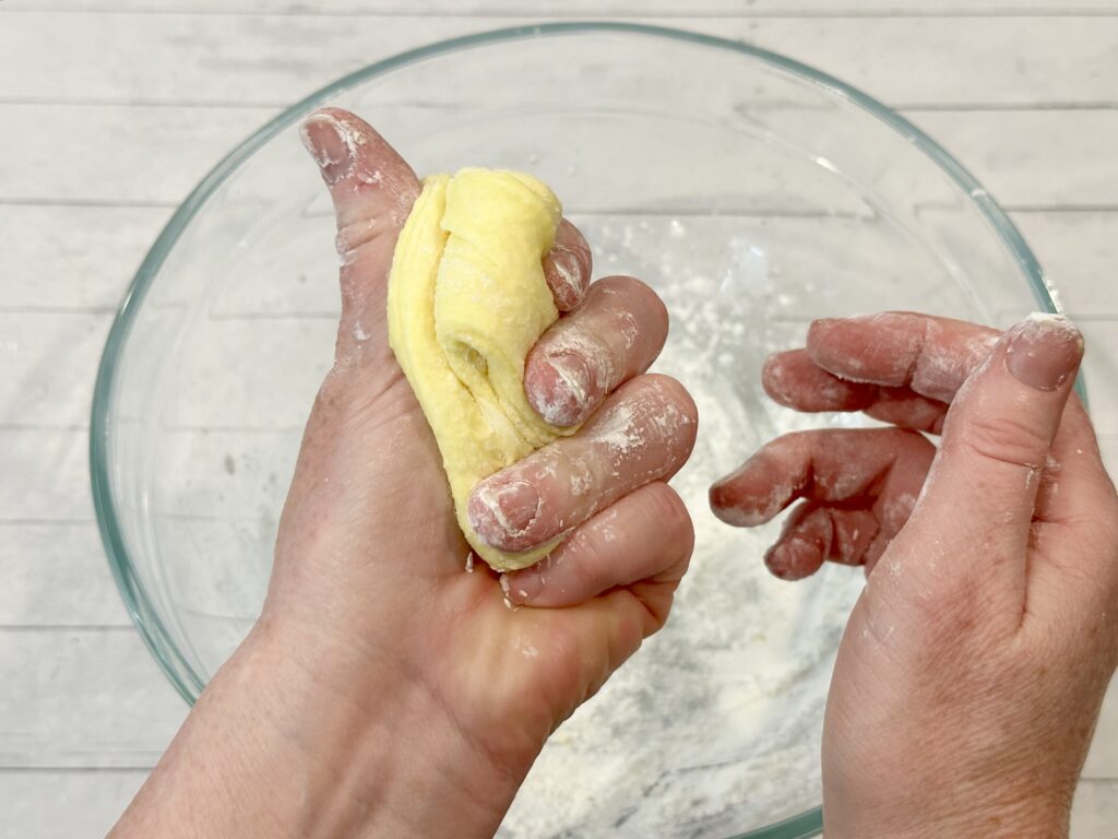 Hands kneading the peeps slime 