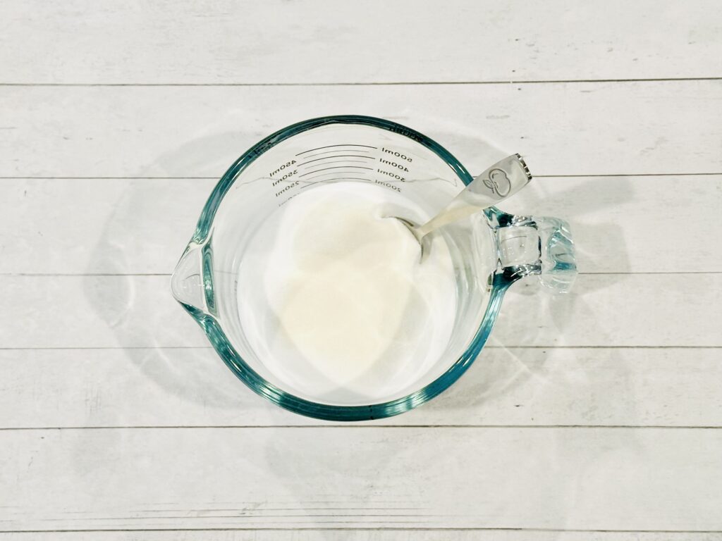 Gelatin powder and baking soda combined in a mixing bowl