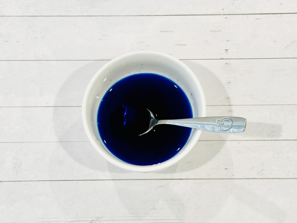 Food coloring and water combined in a bowl