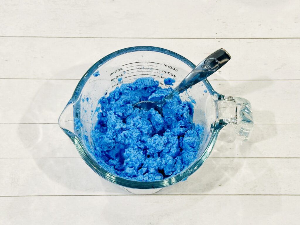 Colored water mixed into the baking soda and gelatin mixure