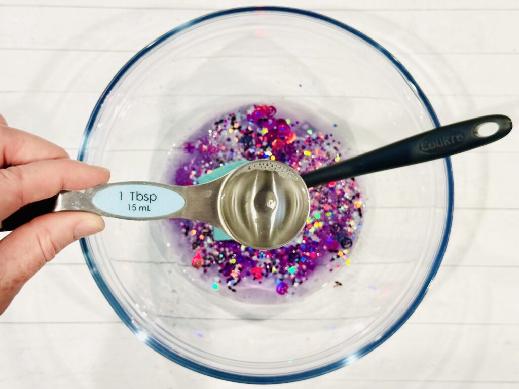 Adding contact solution to slime mixture