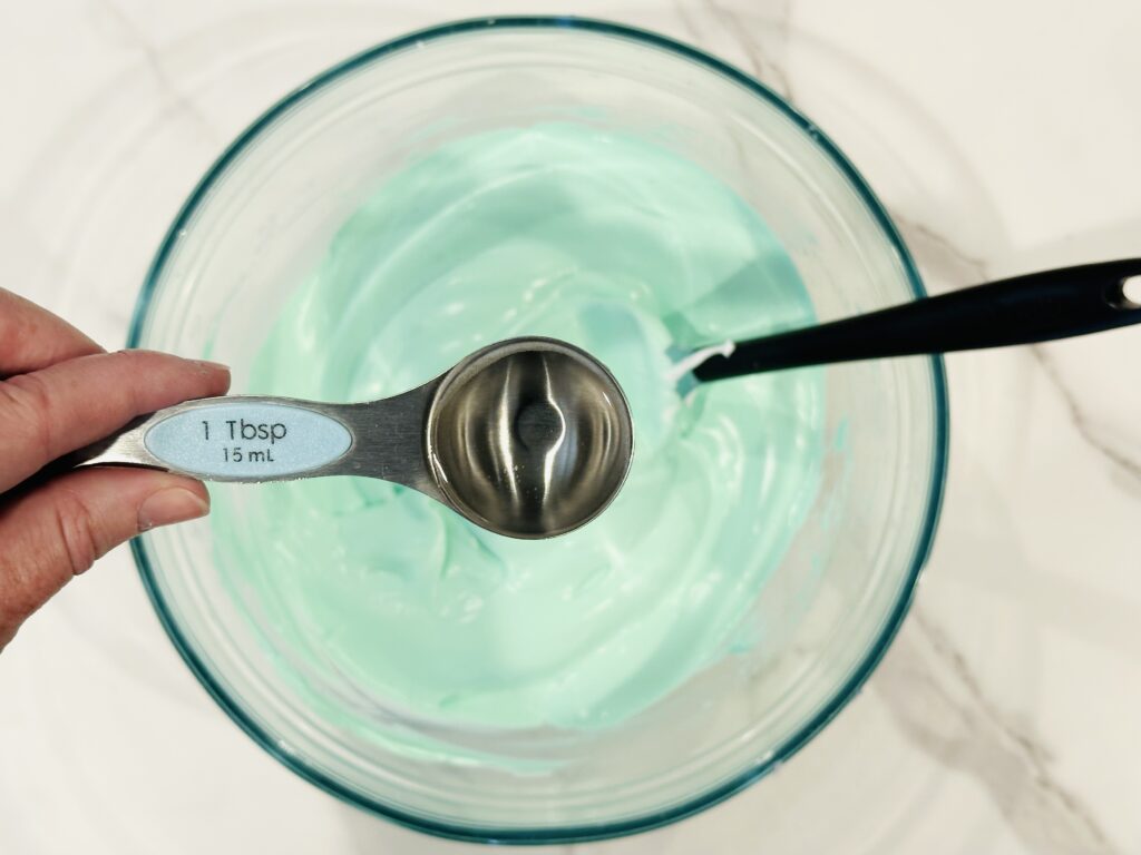 Adding contact solution to the glue and shaving cream mixture