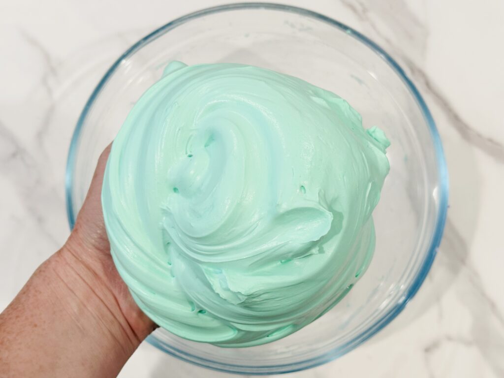 Kneading the fluffy slime with hands.