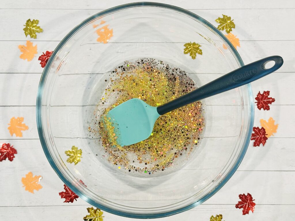 Adding glitter to slime mixture