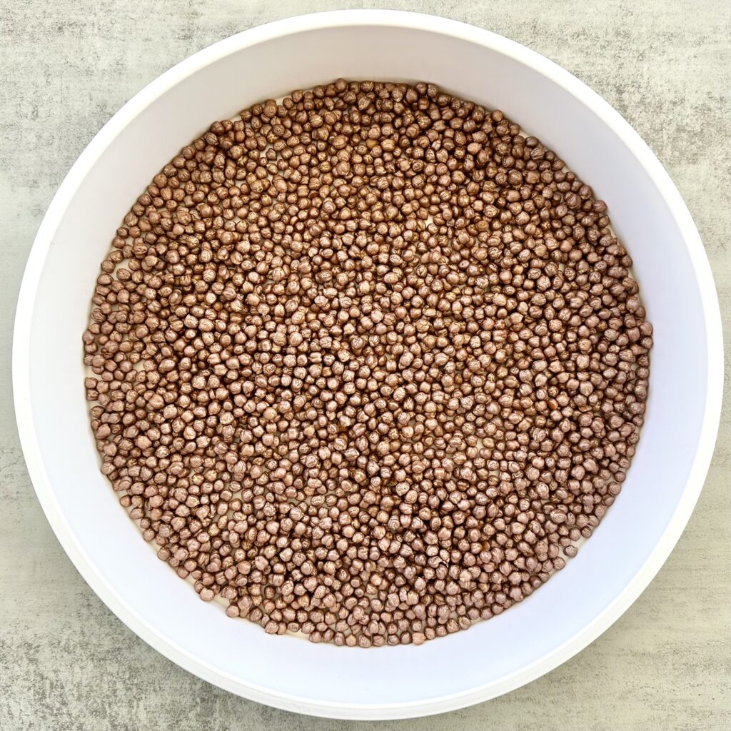 Hot Cocoa Sensory Bin Using DIY Painted Chickpeas